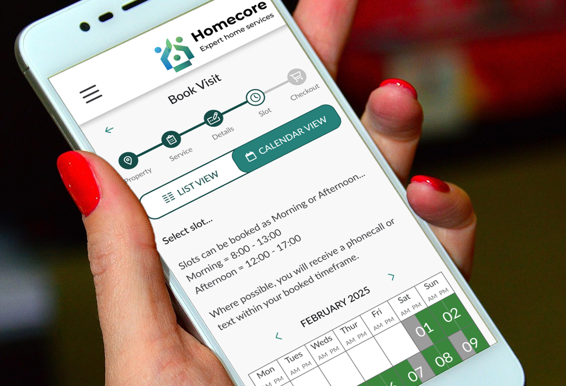Photo of a hand holding a mobile phone, with the Homecore system on screen